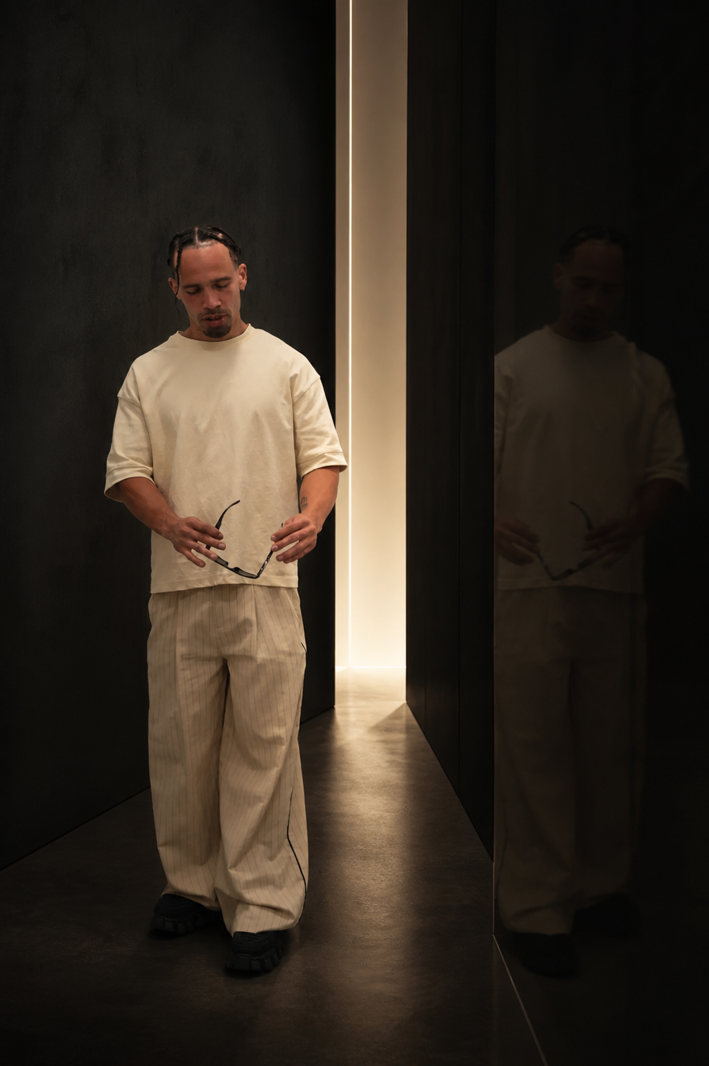 Christian King in a tonal beige look inside the POSTHRS mystery campaign